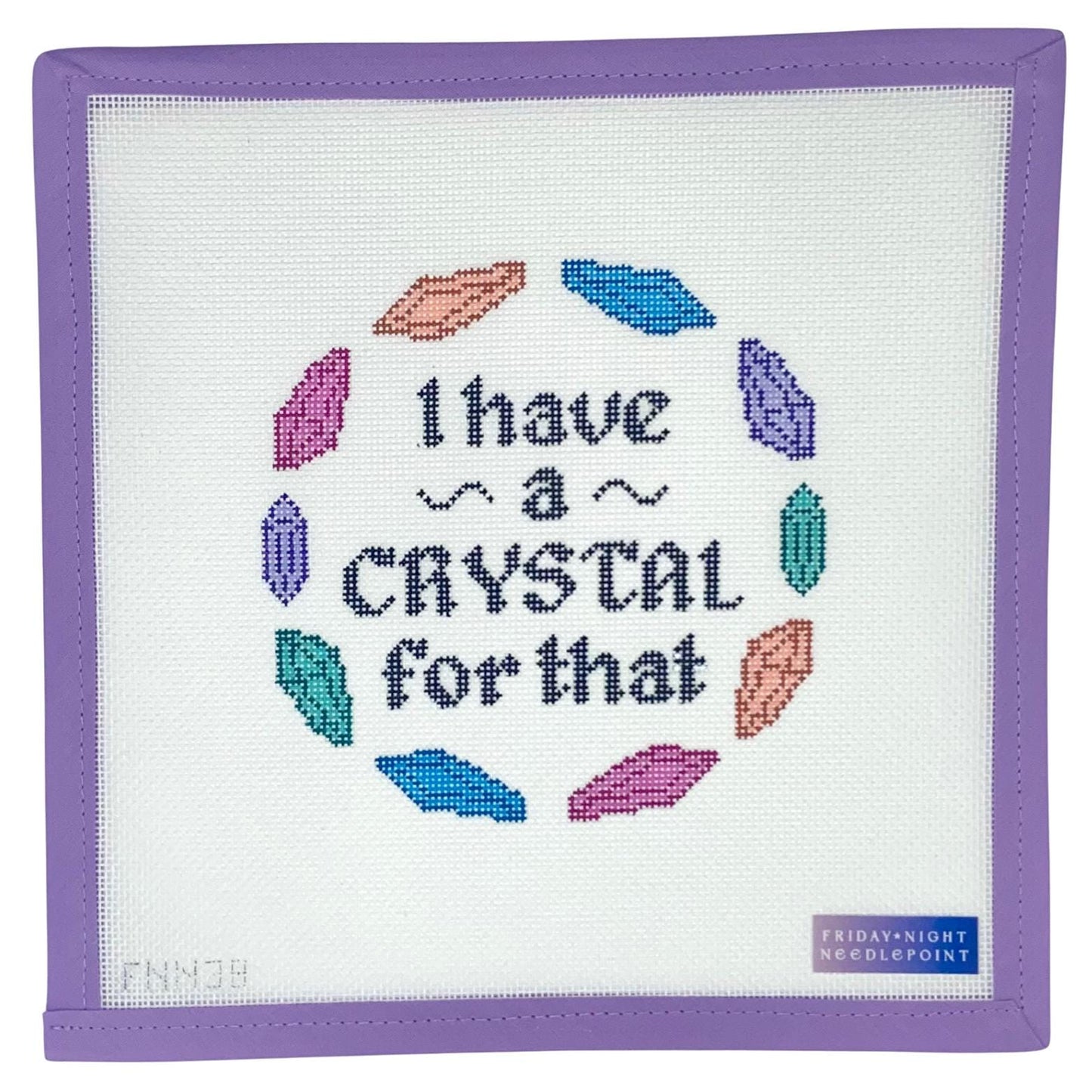 Needlepoint canvas design fabric with colorful crystals and text 'I have a crystal for that' on a white background.