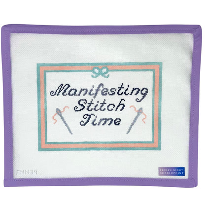 Embroidered patch needlepoint canvas with 'Manifesting Stitch Time' text and needle designs on a white background.