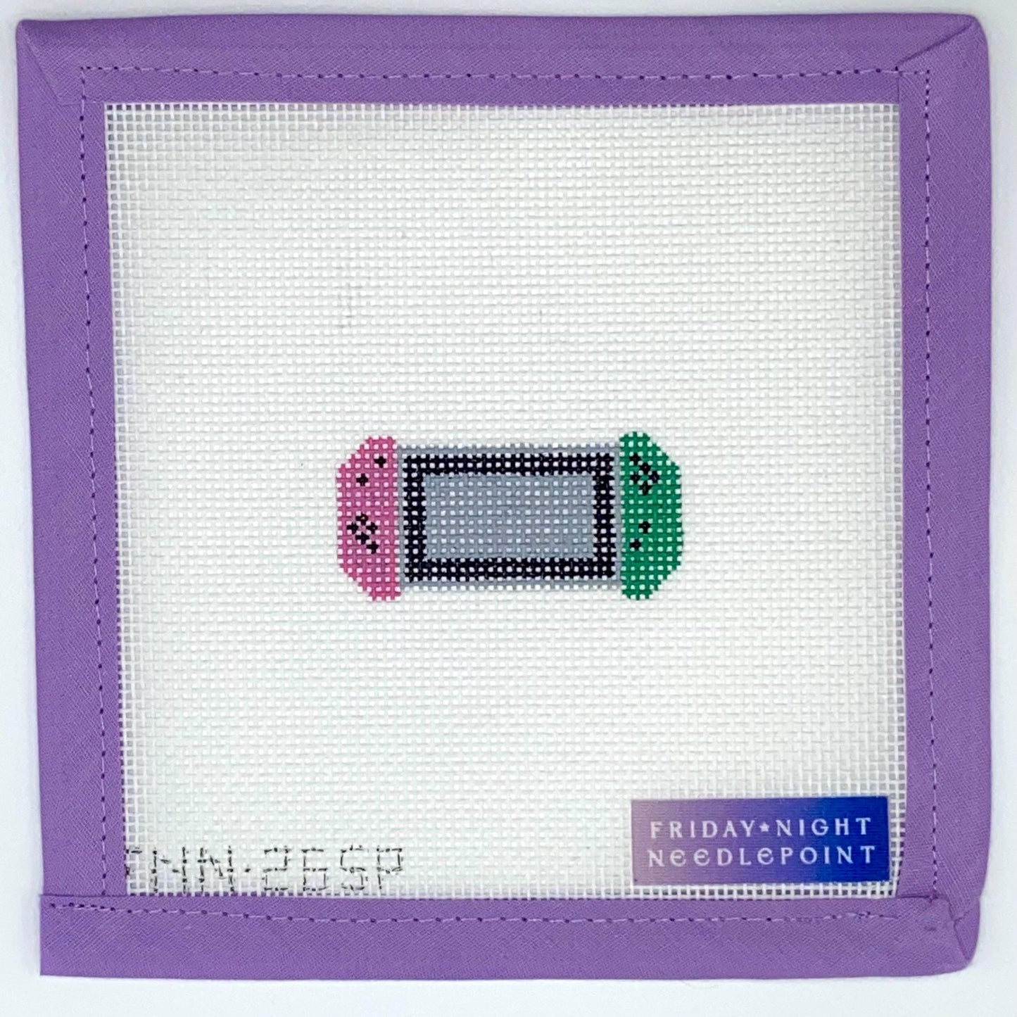 Needlepoint canvas design of a pink green Nintendo switch controller gaming console on a white fabric with purple border, labeled 'Friday Night Needlepoint'.