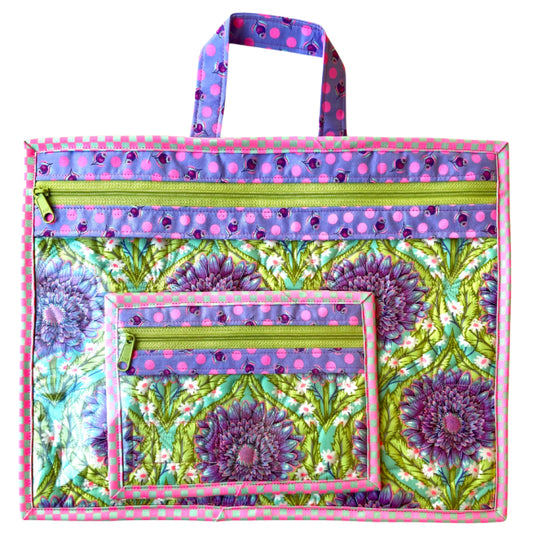 Colorful tote bag with floral pattern and polka dot accents on a white background needlepoint project bag purple daisy quilted