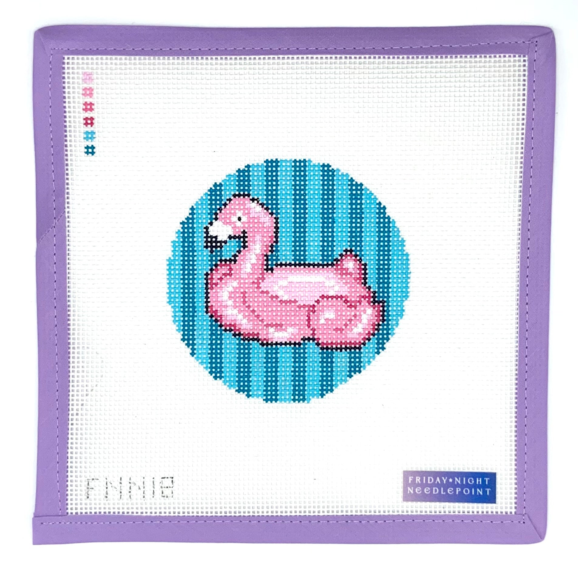 needlepoint flamingo design on a white fabric with purple border, featuring 'Friday Night Needlepoint' branding.