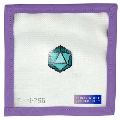 Needlepoint design with a mini D20 green dice 20 sided on a white canvas and purple border
