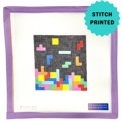Needlepoint design of a colorful block Tetris on a black background puzzle on a grid with a purple border
